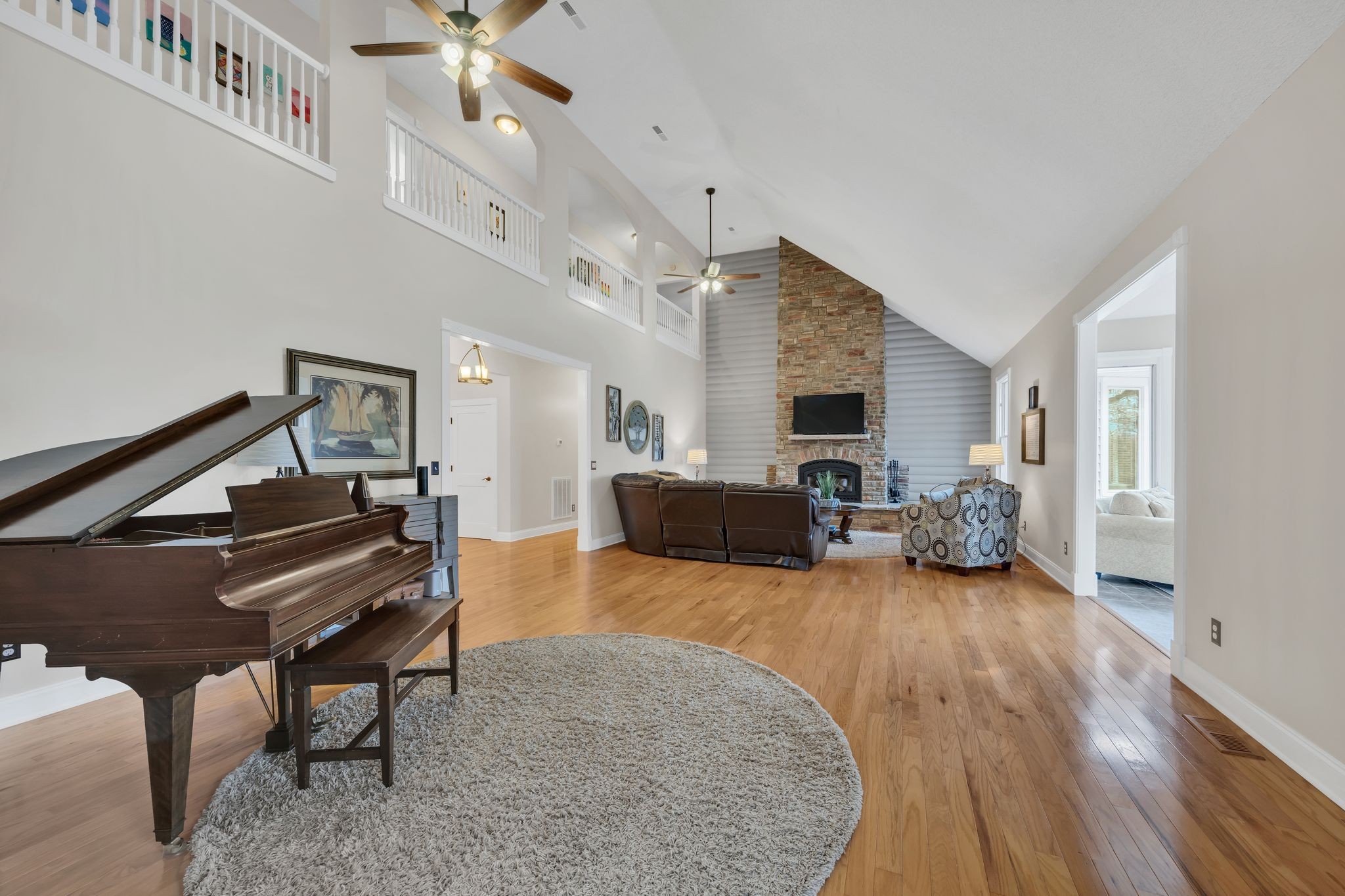1265 Johnny Hall Road Burns, TN 37029 - Photo 13 of 89 Arched overlooks from the second floor adds elegance and a sense of openness to the living space.