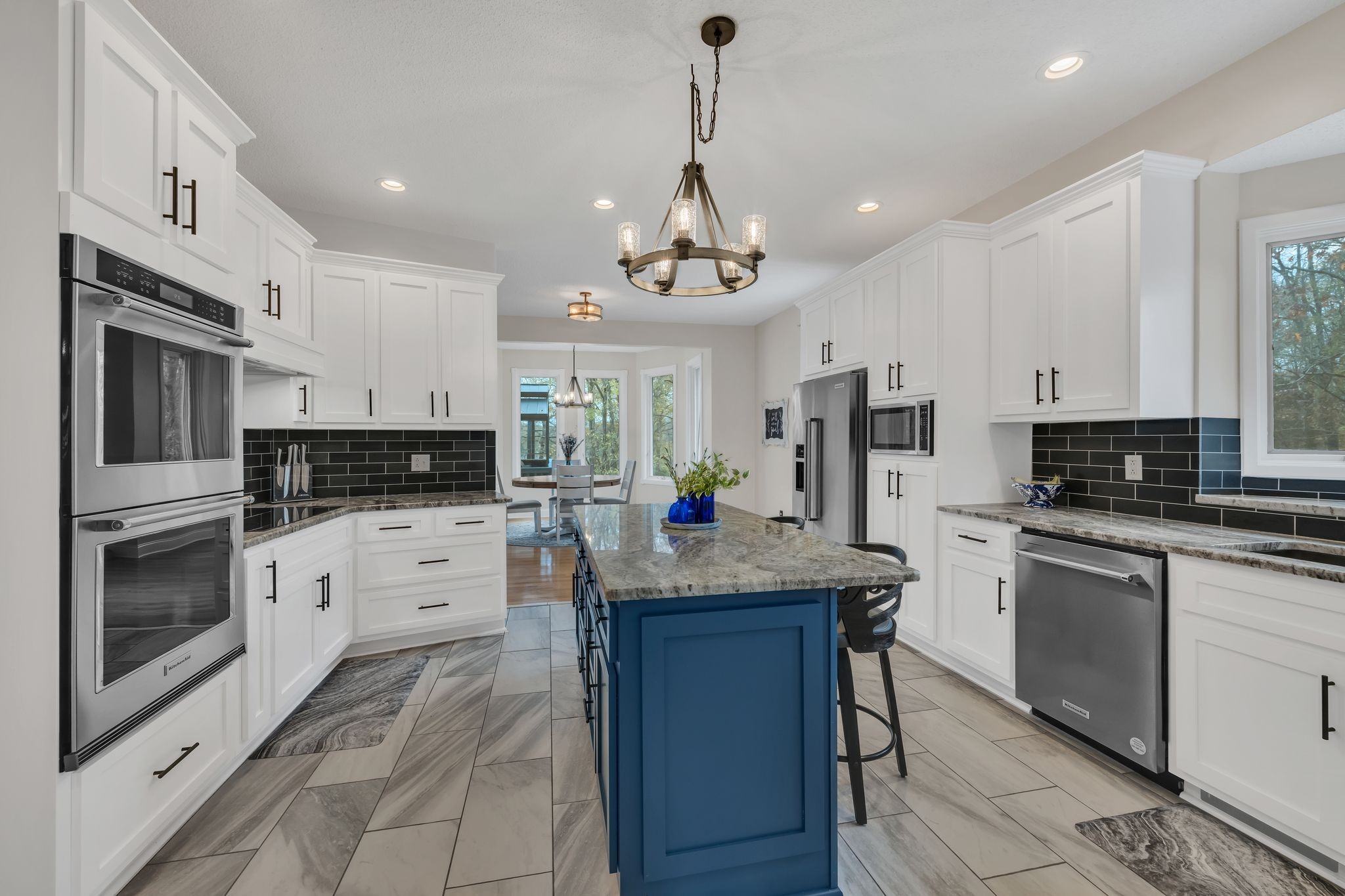 1265 Johnny Hall Road Burns, TN 37029 - Photo 17 of 89 A recently remodeled kitchen featuring custom-grade stainless appliances and beautiful granite countertops.