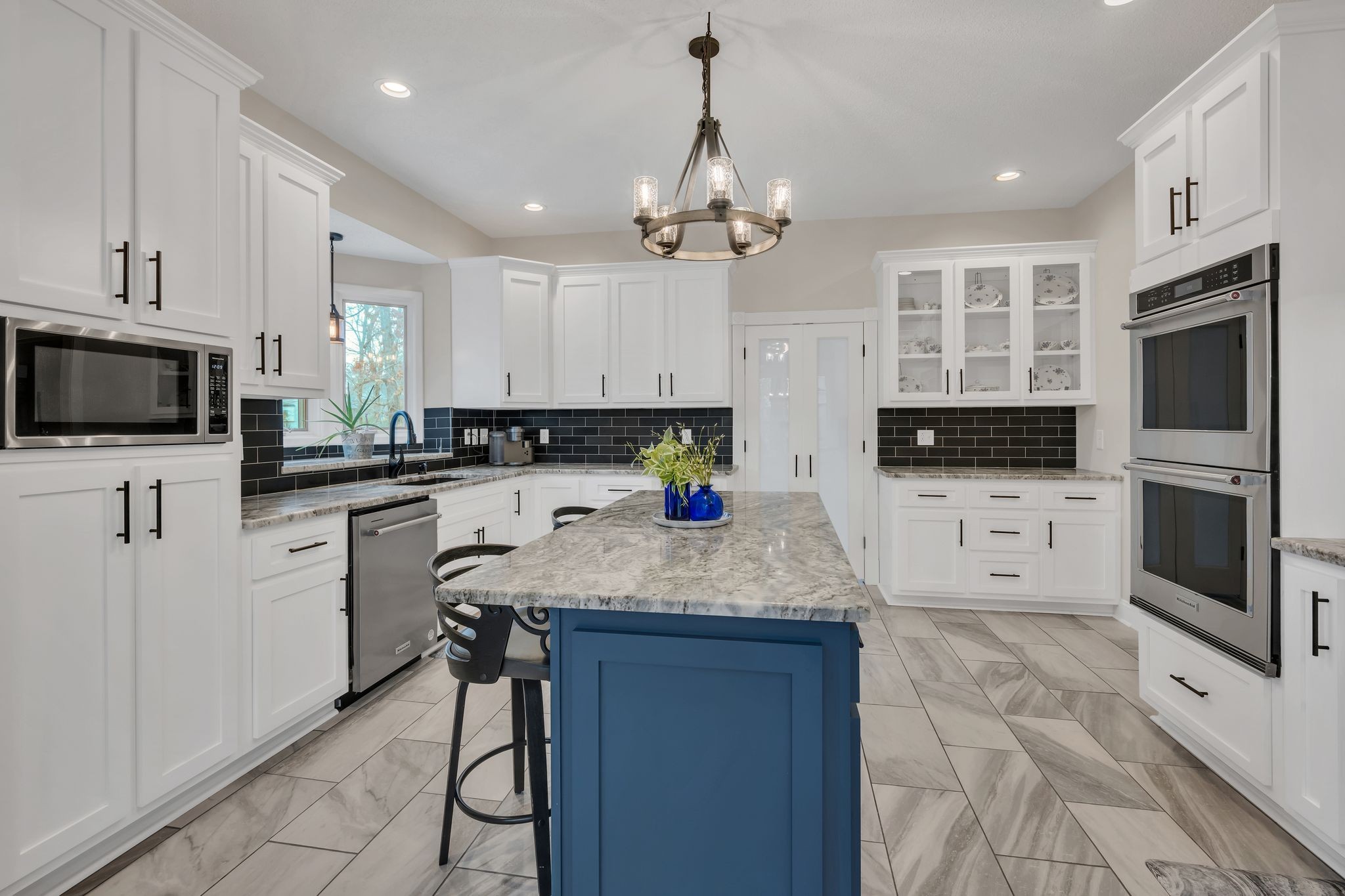 1265 Johnny Hall Road Burns, TN 37029 - Photo 21 of 89 Cook with ease using double ovens and a spacious center island, perfect for meal prep or entertaining.