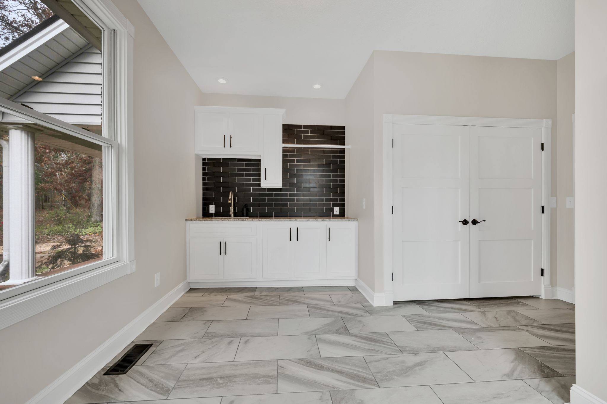 1265 Johnny Hall Road Burns, TN 37029 - Photo 25 of 89 A huge laundry room with modern touches and ample space!