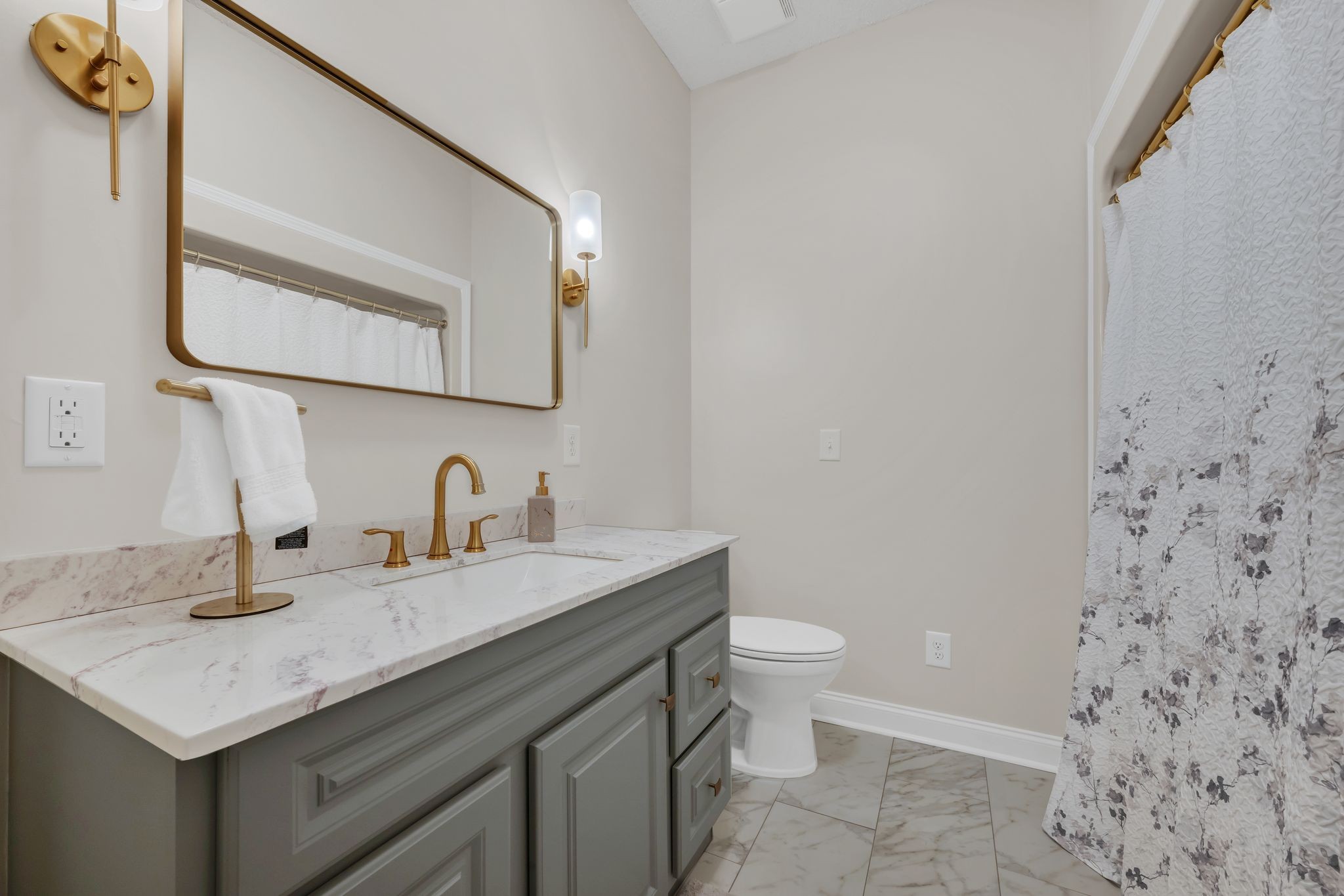 1265 Johnny Hall Road Burns, TN 37029 - Photo 33 of 89 This hall bath is a showstopper, with gorgeous tile and rich gold accents.