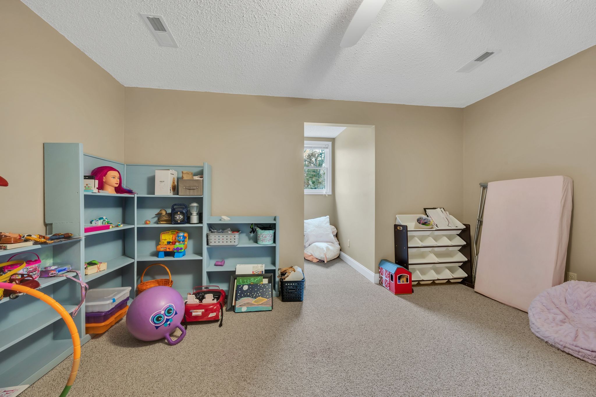 1265 Johnny Hall Road Burns, TN 37029 - Photo 45 of 89 A spacious playroom that can easily double as an extra bedroom, craft room, or home office.