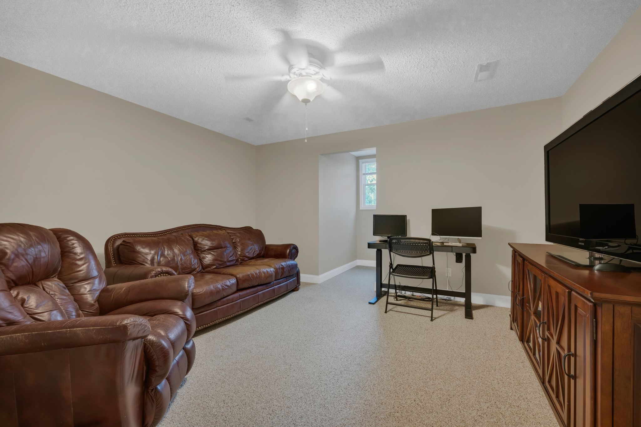 1265 Johnny Hall Road Burns, TN 37029 - Photo 47 of 89 This room is perfect for a home theater, game room, or whatever suits your style.