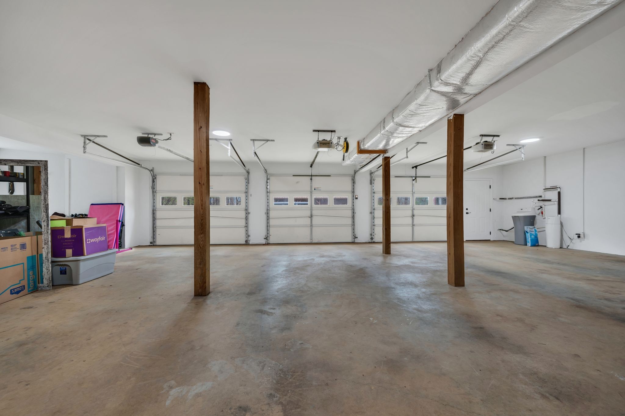 1265 Johnny Hall Road Burns, TN 37029 - Photo 63 of 89 Plenty of space for vehicles and storage in the spacious 3-car garage.