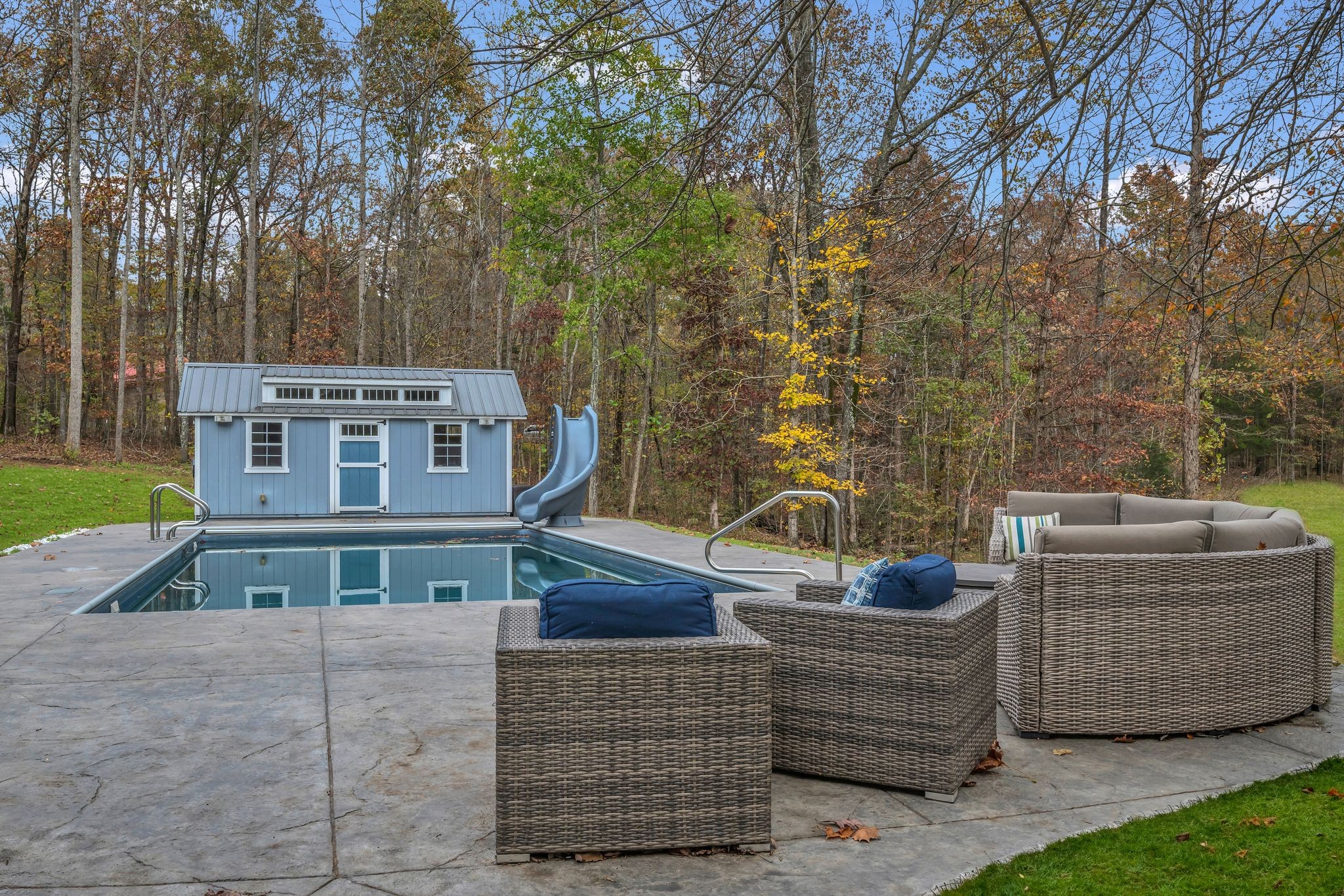 1265 Johnny Hall Road Burns, TN 37029 - Photo 68 of 89 Heated pool, auto cover, custom stamped concrete, and a pool house with its own bathroom for ultimate convenience.