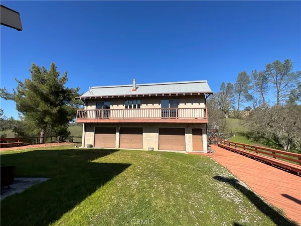 a view of a large pool with a big yard