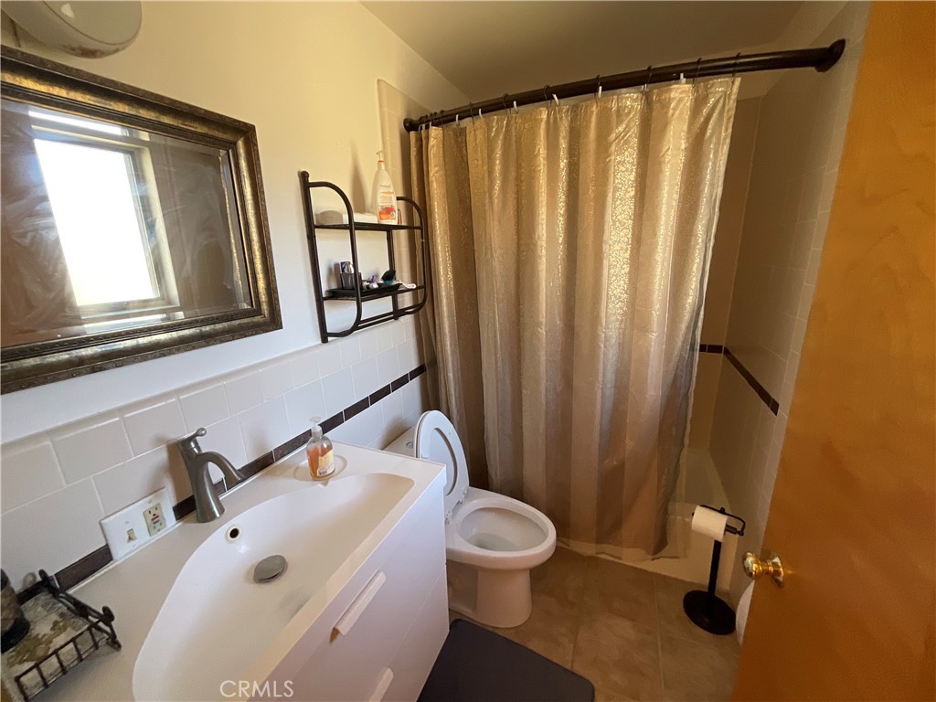 49397 Sapaque Road Bradley, CA 93426 - Photo 12 of 48 a bathroom with a sink and mirror with toilet