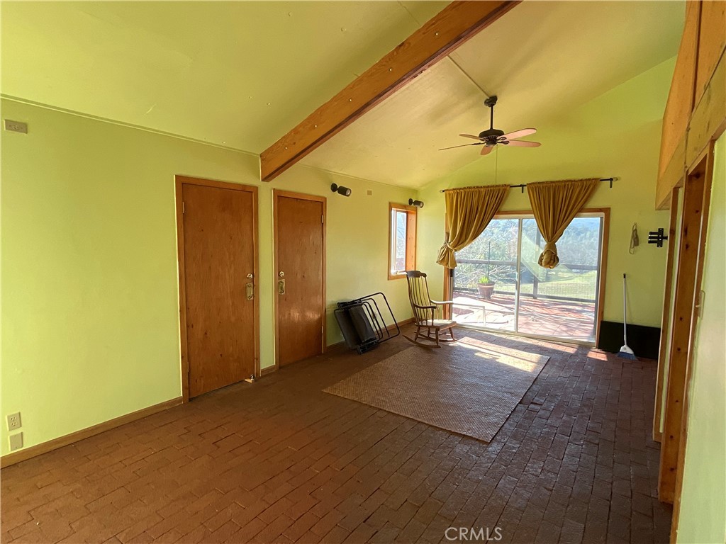 49397 Sapaque Road Bradley, CA 93426 - Photo 22 of 48 a view of a hallway with wooden floor and a bathroom