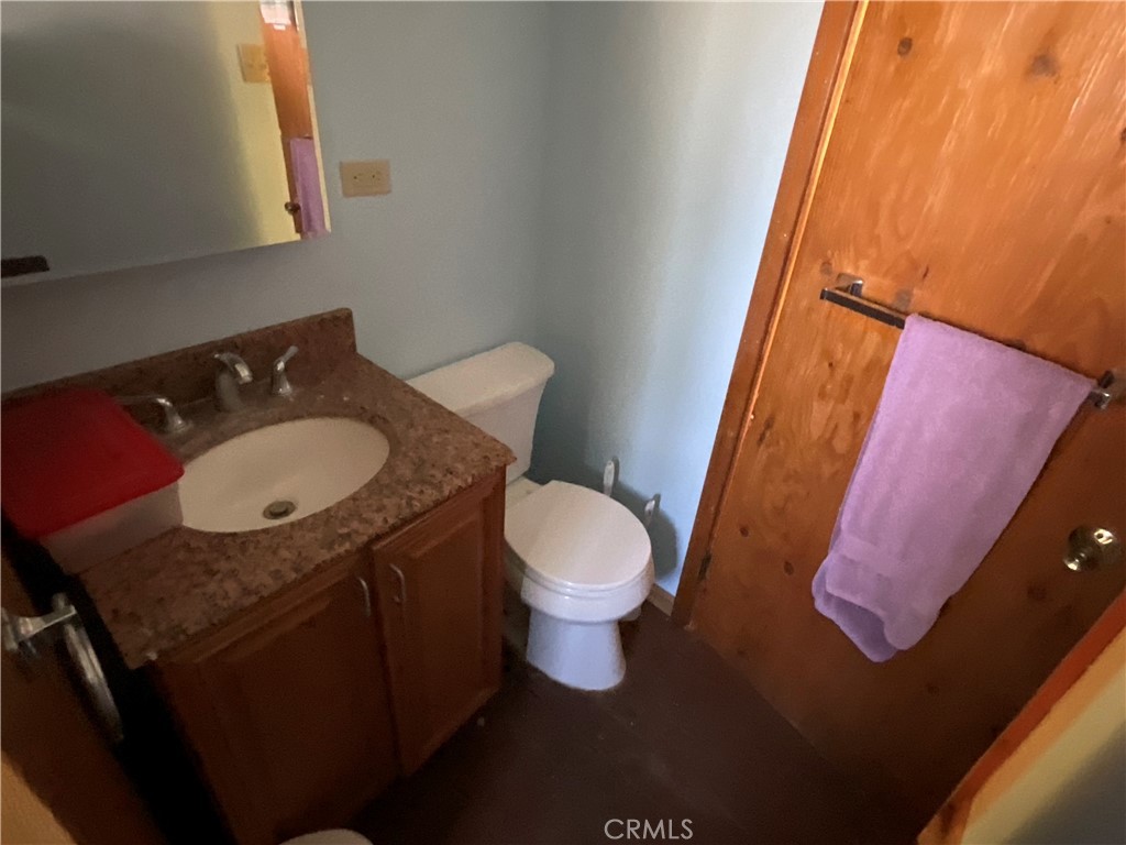49397 Sapaque Road Bradley, CA 93426 - Photo 24 of 48 a bathroom with a sink toilet and a mirror