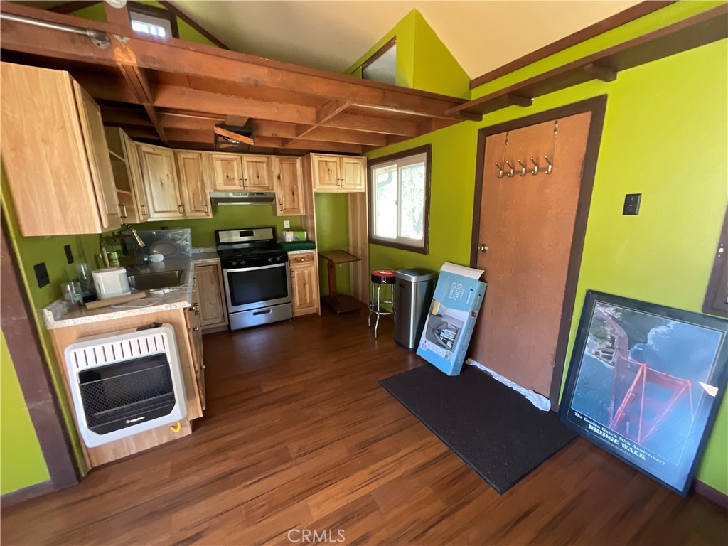 49397 Sapaque Road Bradley, CA 93426 - Photo 37 of 48 a view of a kitchen with fridge and wooden floor