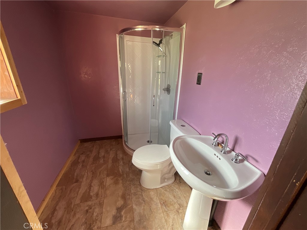 49397 Sapaque Road Bradley, CA 93426 - Photo 38 of 48 a bathroom with a sink a toilet and a mirror