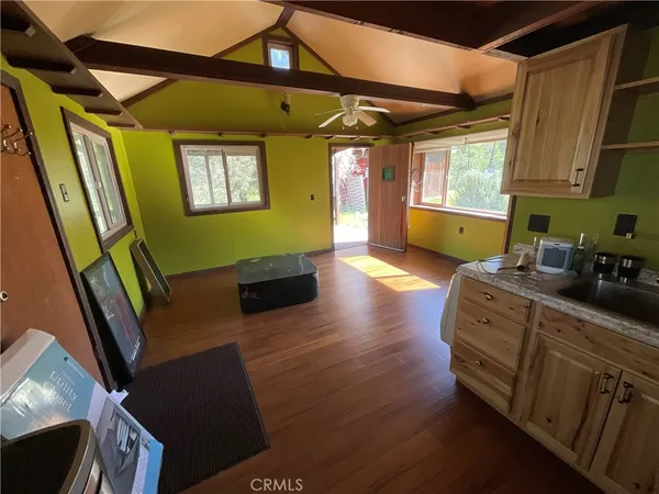 a view of entryway and kitchen