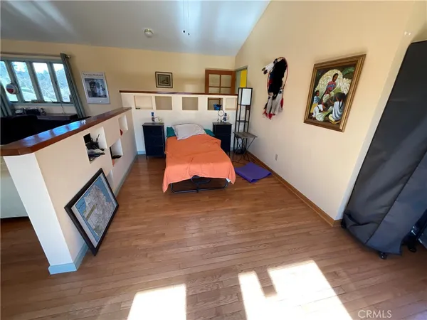 a view of an entryway with wooden floor