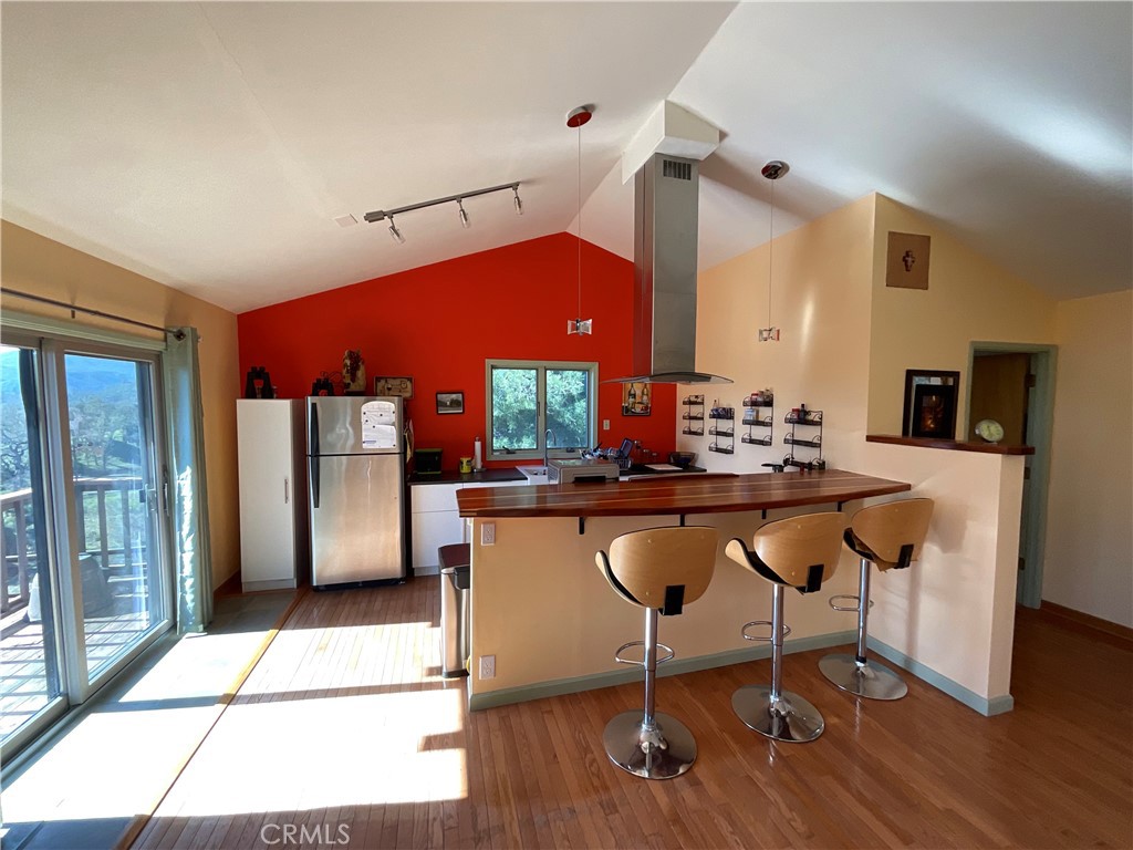 49397 Sapaque Road Bradley, CA 93426 - Photo 7 of 48 a living room with stainless steel appliances kitchen island granite countertop furniture a rug and a large window
