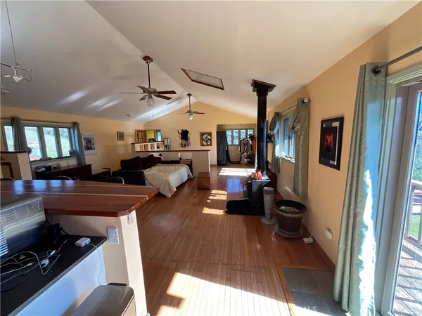 a living room with furniture or couch and a stove