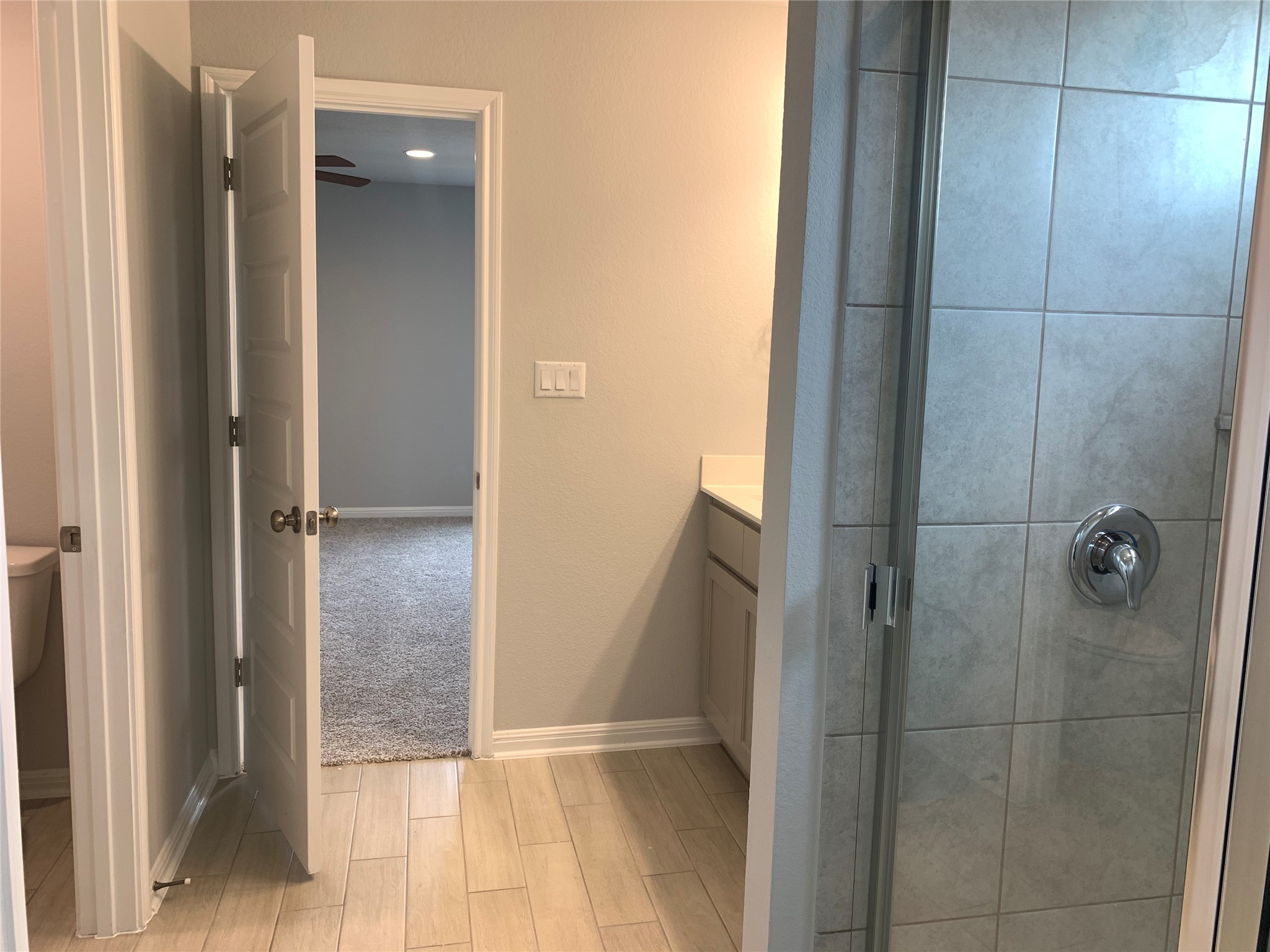 2948 Sage Ranch Drive Leander, TX 78641 - Photo 12 of 28 A well-appointed bath boasts sleek tiled floors and a contemporary glass-enclosed shower.