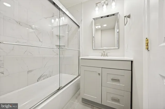 a bathroom with a bathtub and a sink
