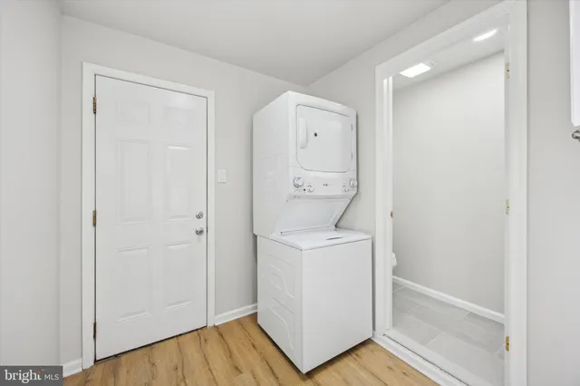 a view of storage and utility room with washer and dryer