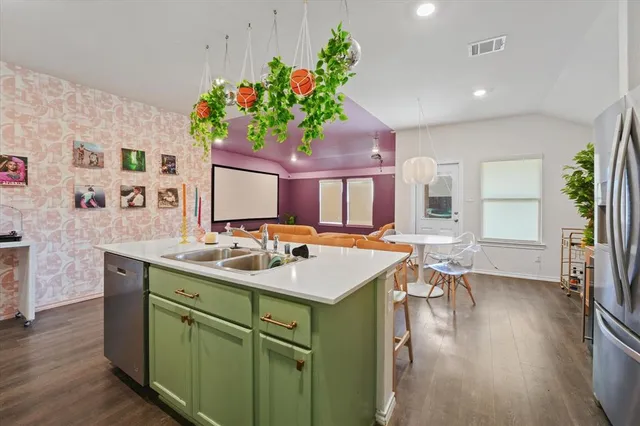 a spacious bathroom with a sink mirror and vanity