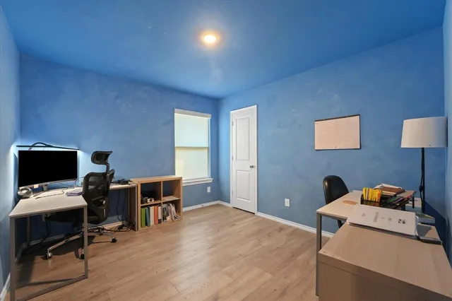 a workspace with furniture and a window