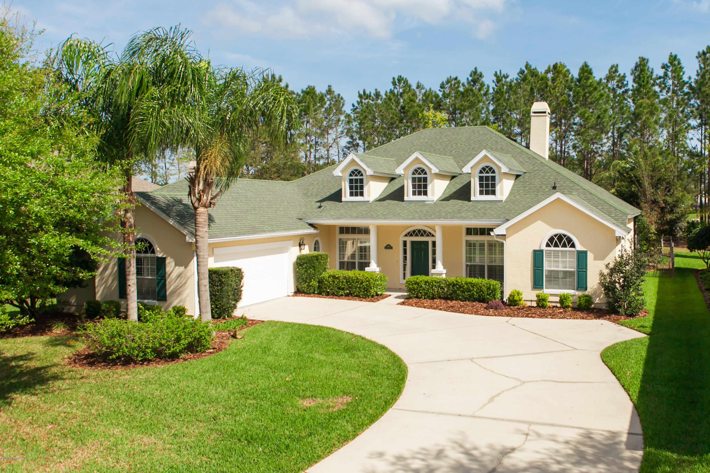 1884 South Landguard Road St. Augustine, FL 32092 - Photo 54 of 66 a front view of a house with a yard