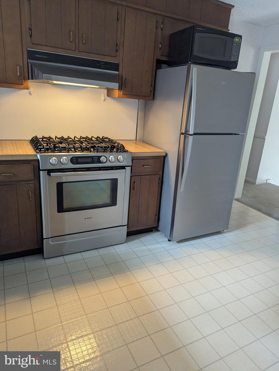 120 Margate Road York, PA 17408 - Photo 15 of 28 a kitchen with a stove and a refrigerator