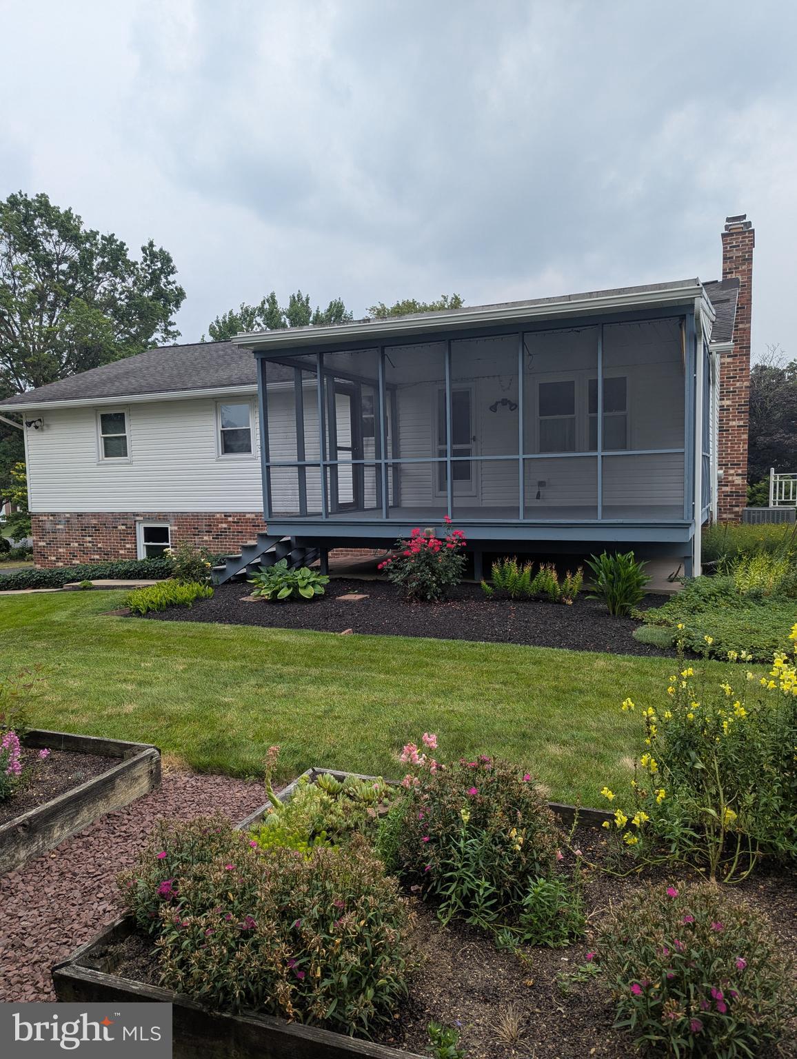 120 Margate Road York, PA 17408 - Photo 4 of 28 a view of a house with backyard sitting area and garden