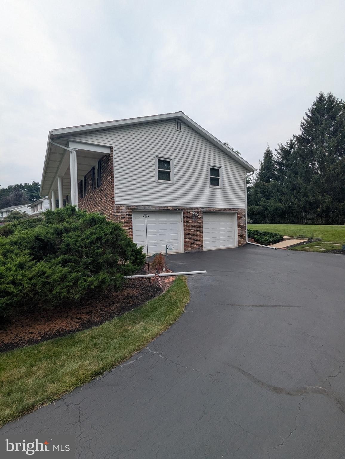 120 Margate Road York, PA 17408 - Photo 5 of 28 a view of a house with a yard and a large parking space