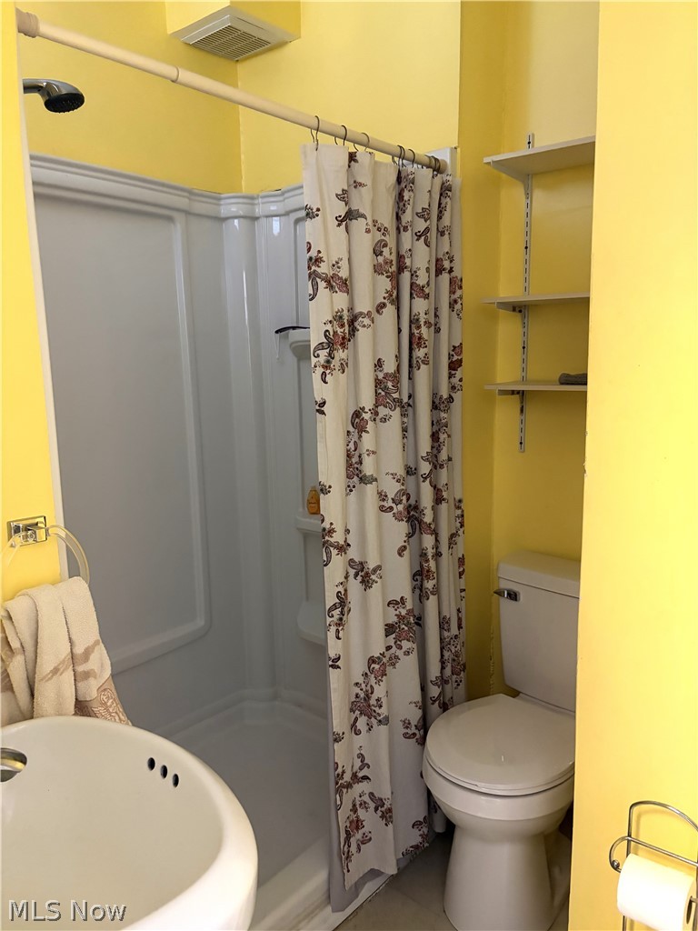 969 Evangeline Road Cleveland, OH 44110 - Photo 23 of 38 Full bath with a shower stall and toilet
