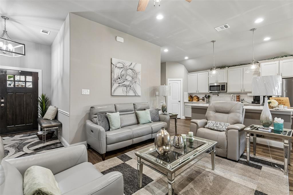108 Maverick Lane Pilot Point, TX 76258 - Photo 4 of 27 Open-concept living area featuring wood-finish flooring, recessed lighting, and a neutral wall color