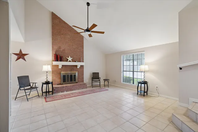 a view of a livingroom with furniture and a window