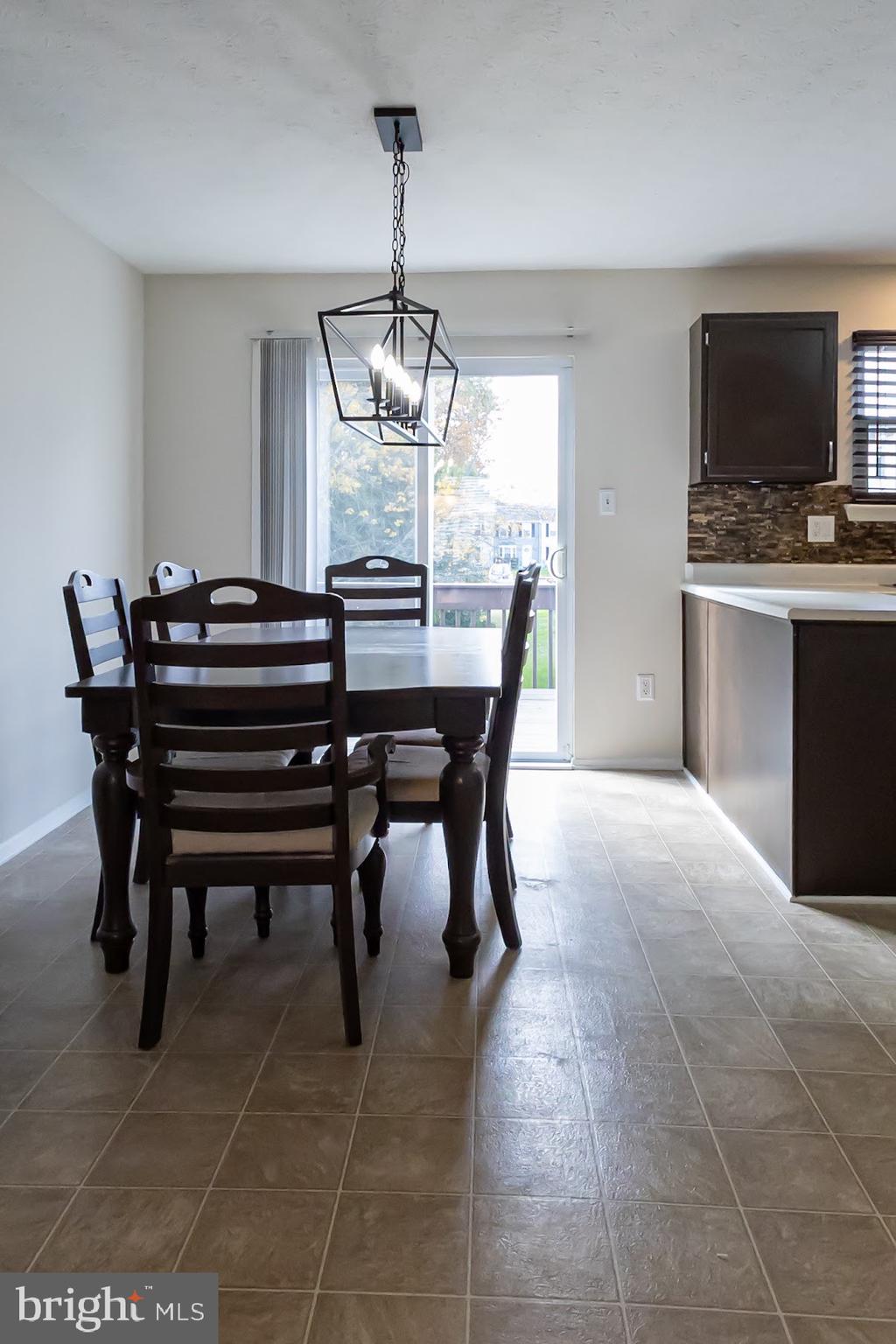 511 Kosoak Road Baltimore, MD 21220 - Photo 11 of 63 a view of a dining room with furniture