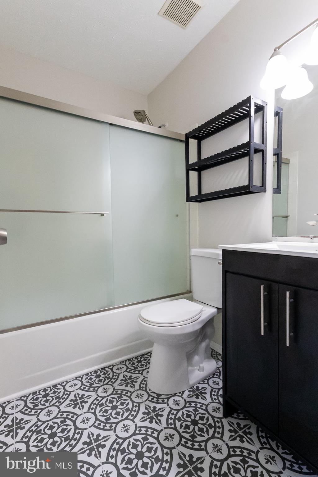 511 Kosoak Road Baltimore, MD 21220 - Photo 17 of 63 a bathroom with a toilet a sink and a shower