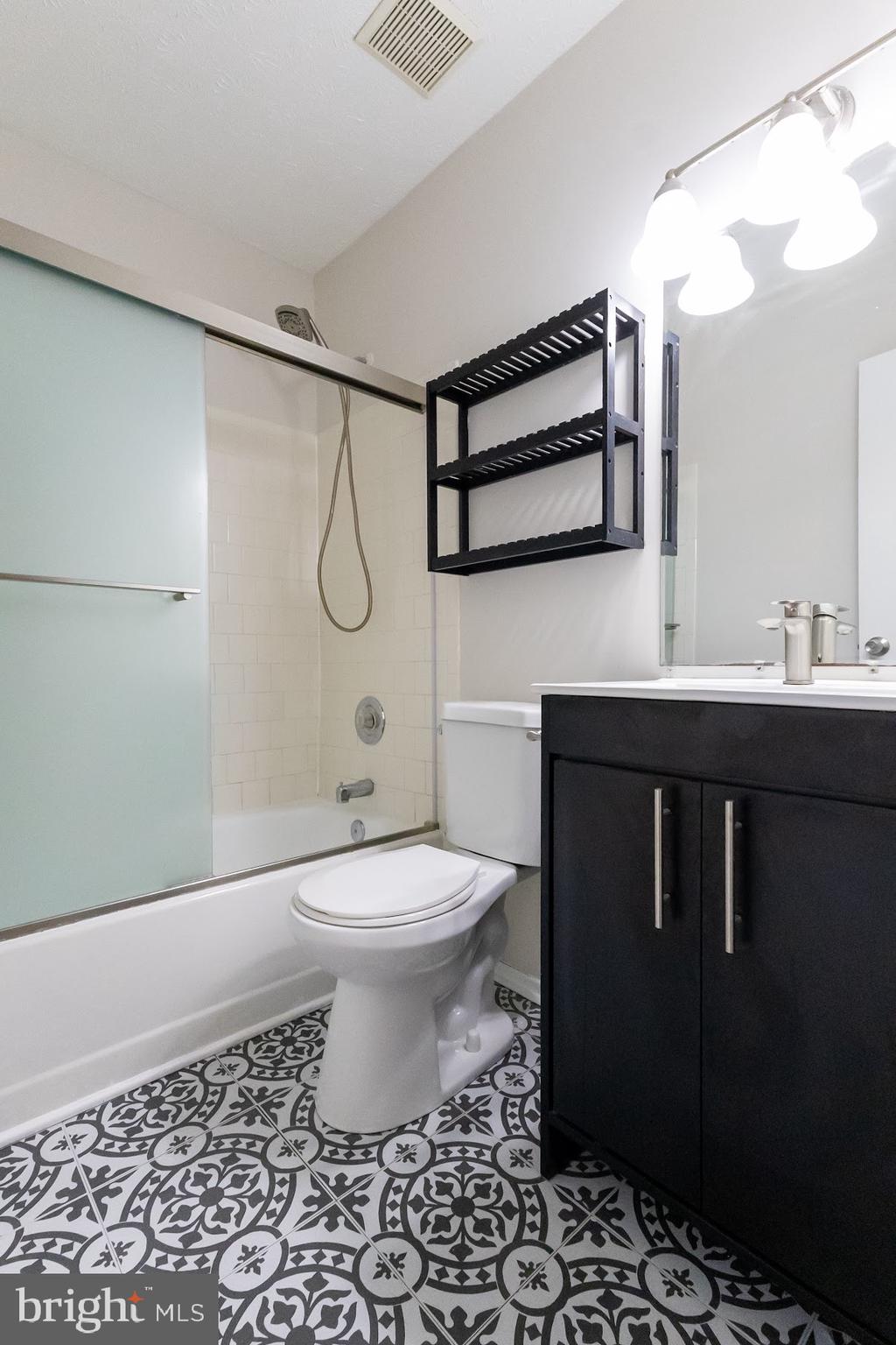 511 Kosoak Road Baltimore, MD 21220 - Photo 21 of 63 a bathroom with a sink toilet vanity and shower