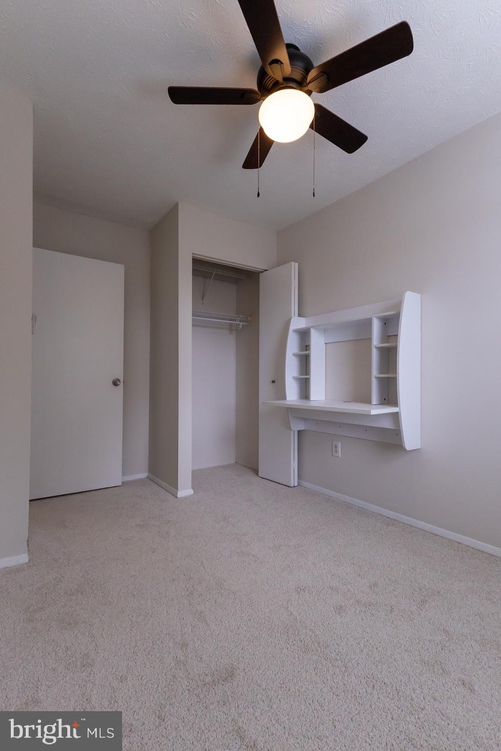 511 Kosoak Road Baltimore, MD 21220 - Photo 30 of 63 an empty room with chandelier fan and windows