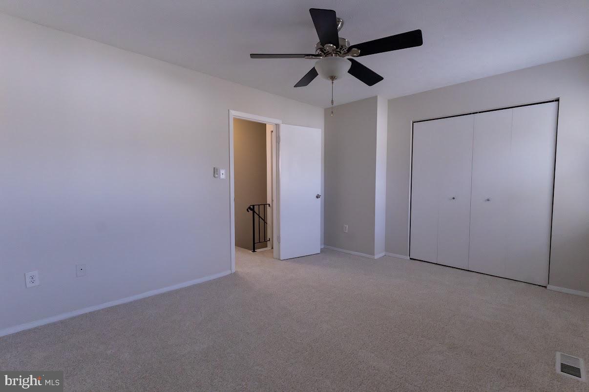 511 Kosoak Road Baltimore, MD 21220 - Photo 37 of 63 an empty room with a ceiling fan and a ceiling fan