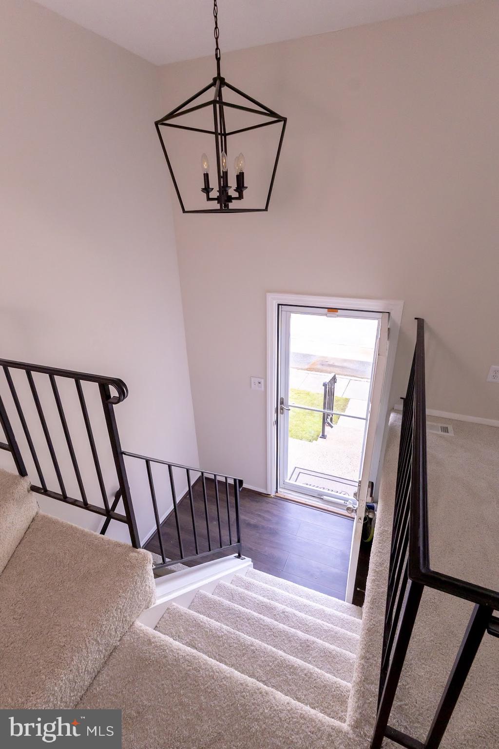 511 Kosoak Road Baltimore, MD 21220 - Photo 41 of 63 a view of a hallway with wooden floor and stairs