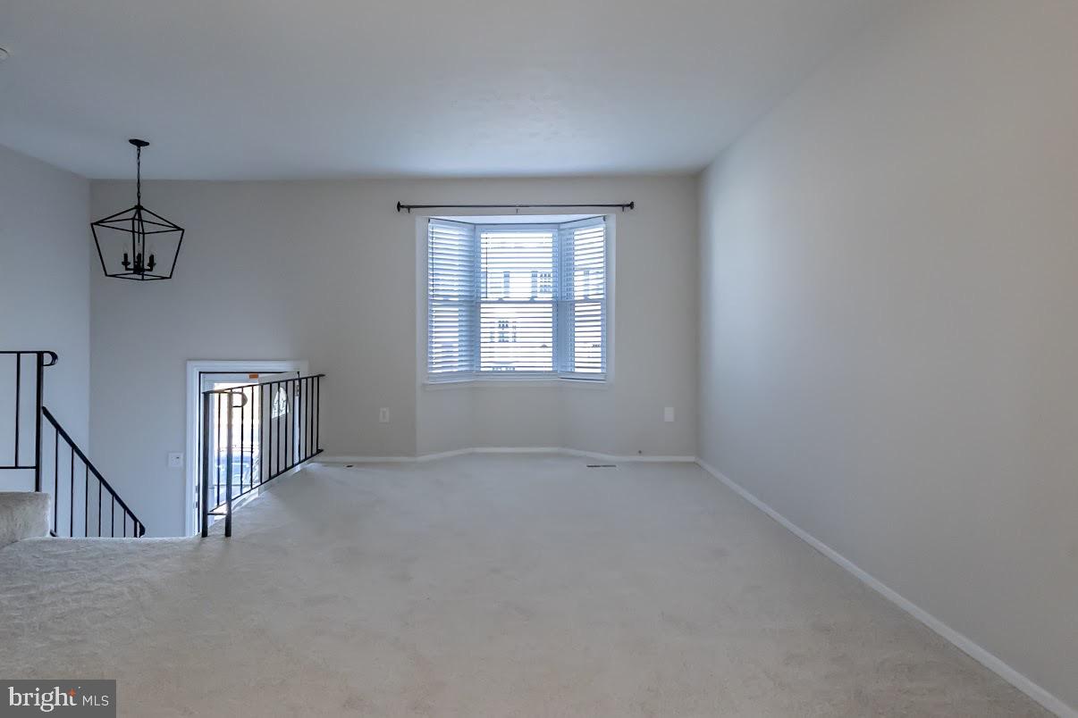 511 Kosoak Road Baltimore, MD 21220 - Photo 5 of 63 a view of empty room with windows