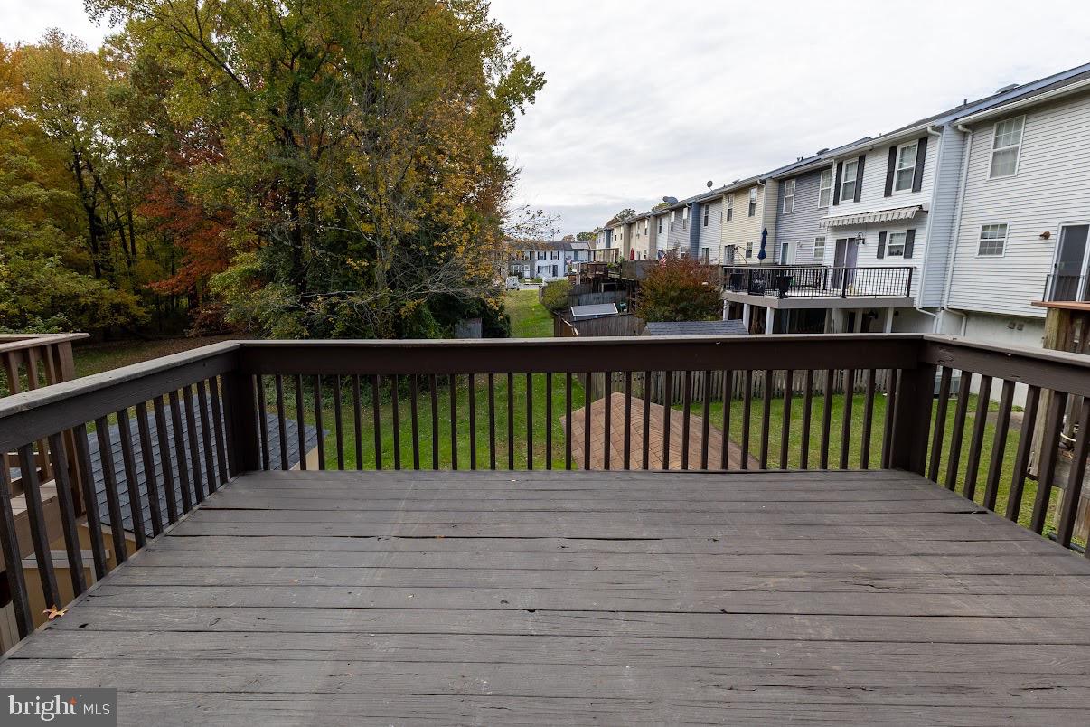 511 Kosoak Road Baltimore, MD 21220 - Photo 51 of 63 a balcony view with wooden floor and fence
