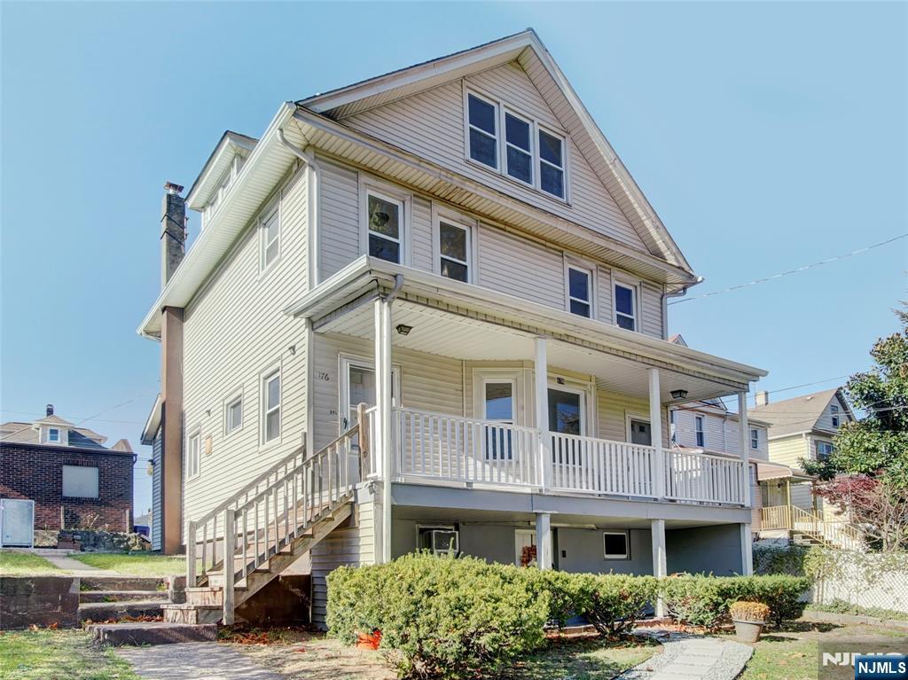 1761 Teaneck Road Teaneck, NJ 07666 - Photo 1 of 14 a front view of a building with a garden