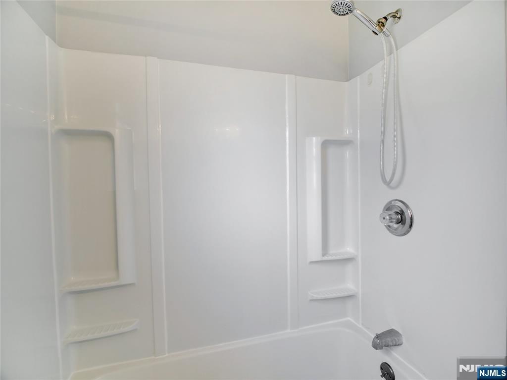 1761 Teaneck Road Teaneck, NJ 07666 - Photo 12 of 14 a bathroom with a bathtub