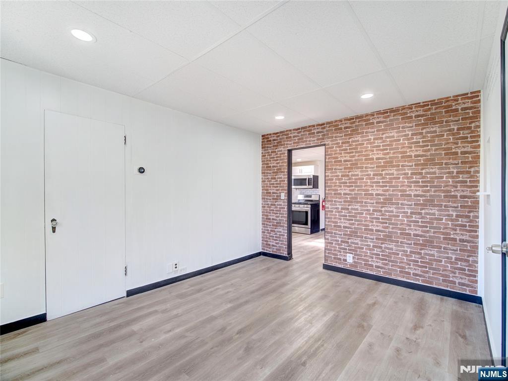 1761 Teaneck Road Teaneck, NJ 07666 - Photo 4 of 14 a view of an empty room with wooden floor and closet