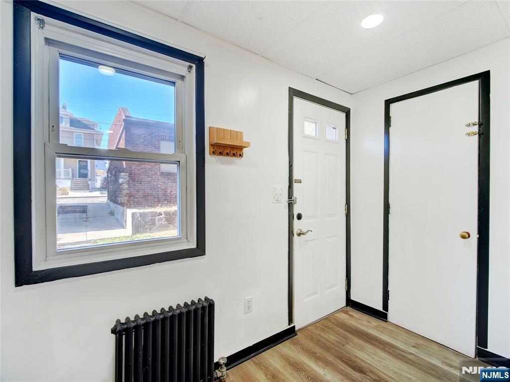 1761 Teaneck Road Teaneck, NJ 07666 - Photo 7 of 14 a view of a hallway with wooden floor and a door