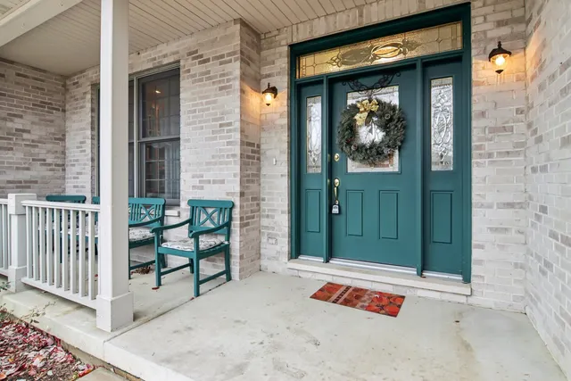 a view of a livingroom with furniture and a staircase