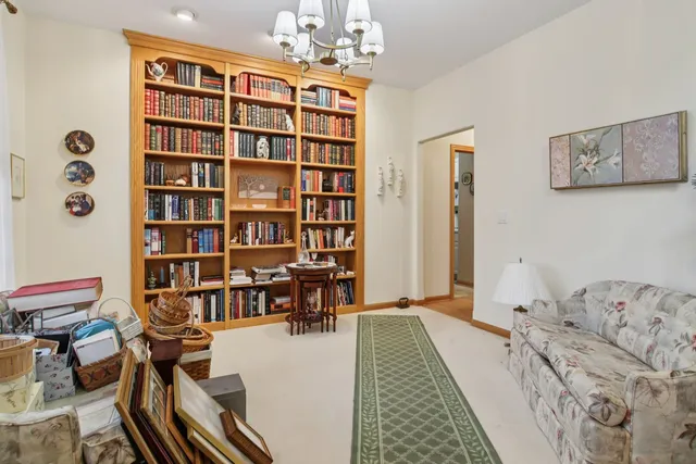 a kitchen with a stove a refrigerator a sink and dishwasher with wooden floor