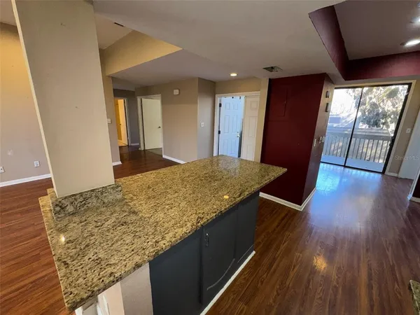 a view of kitchen island wooden floor