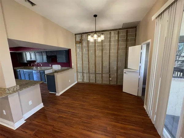 a view of a kitchen with a sink and a fireplace
