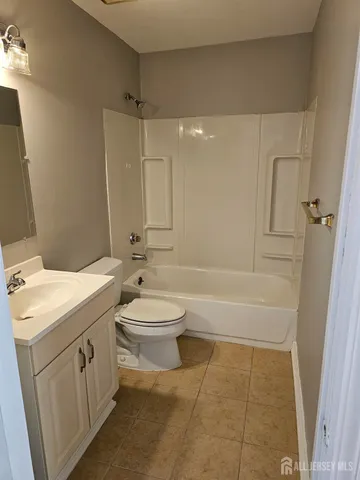 a bathroom with a toilet a sink and bathtub