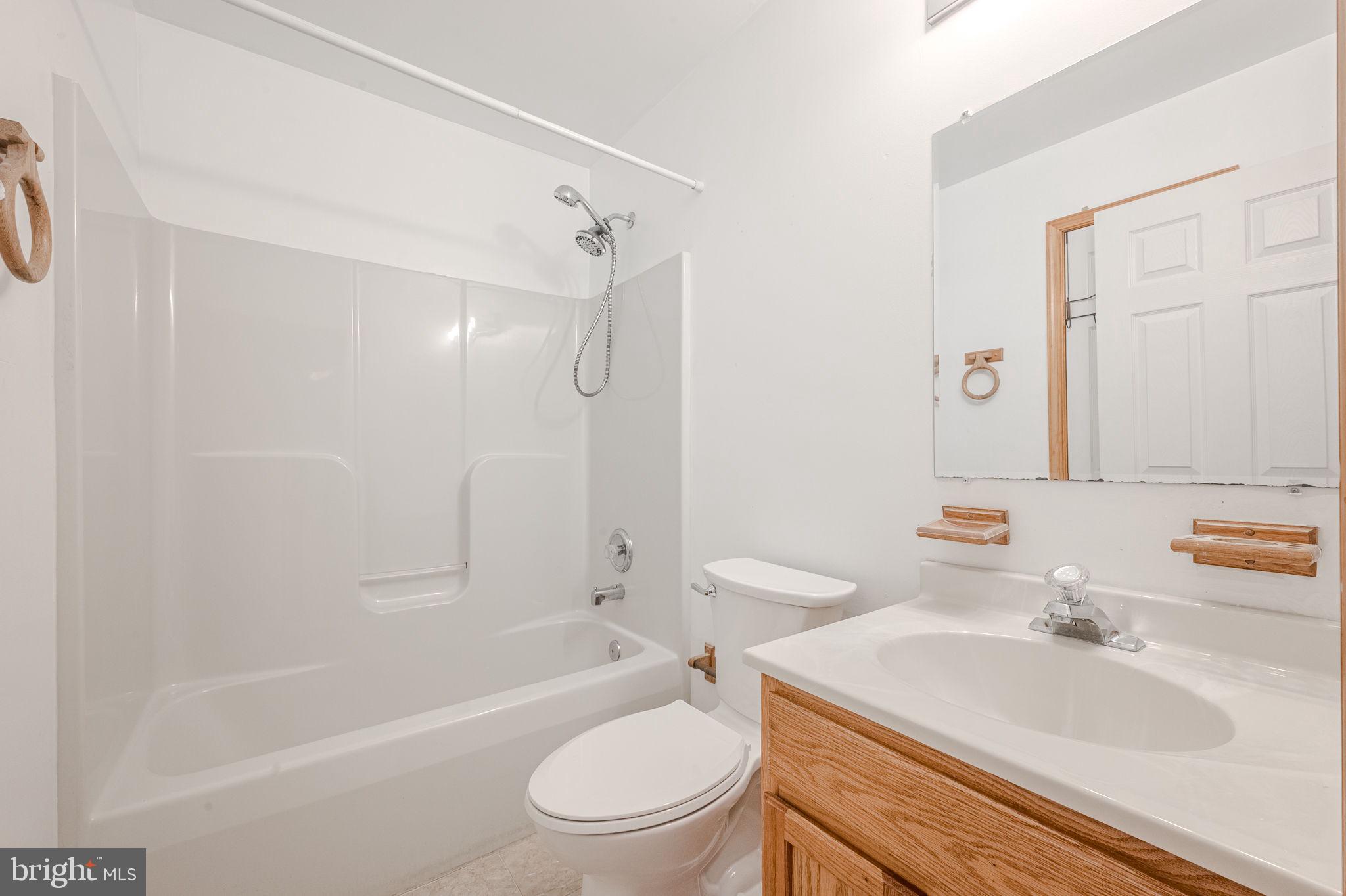 6 Windsor Court Elkton, MD 21921 - Photo 19 of 37 a bathroom with a sink toilet and shower
