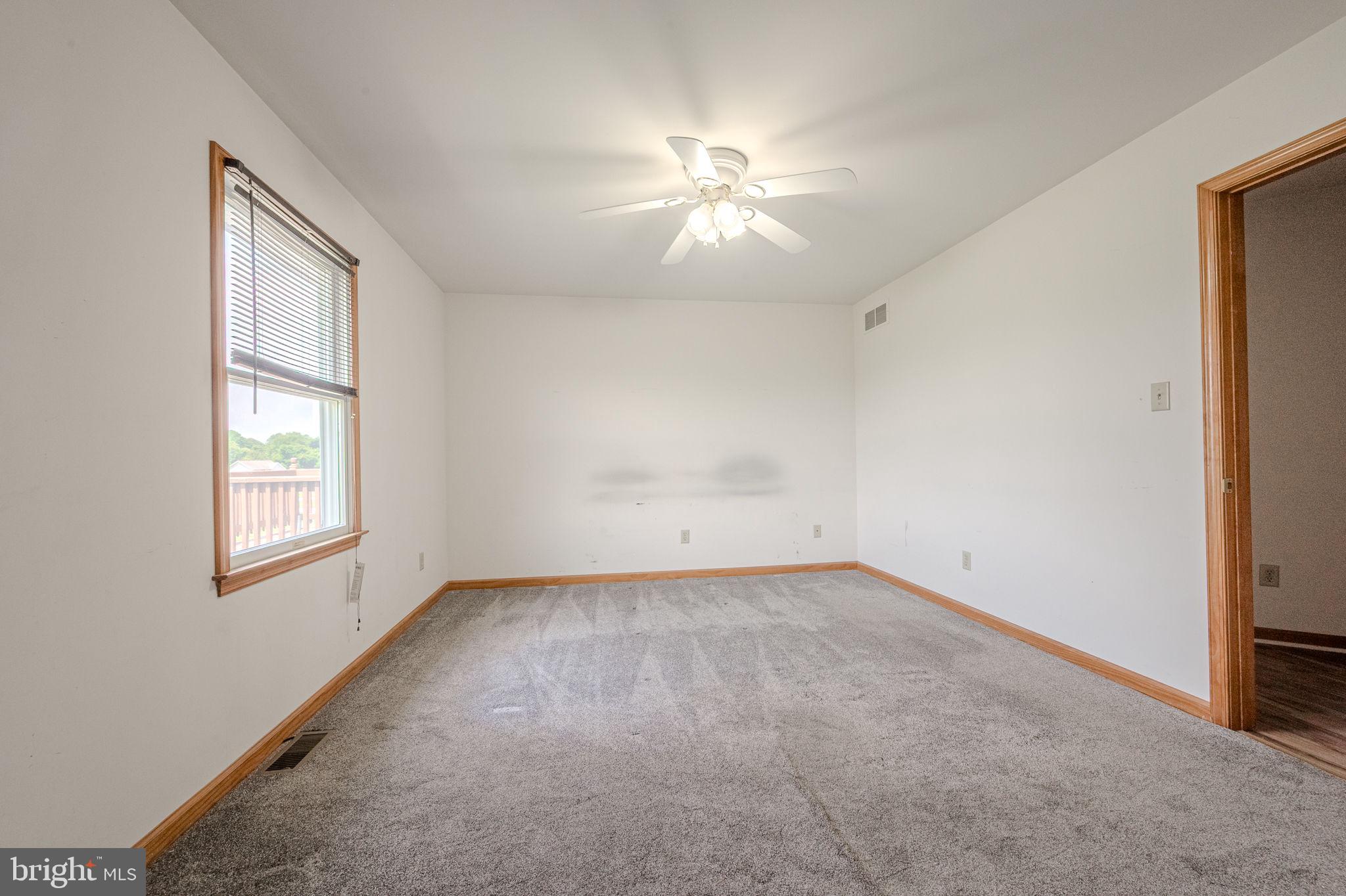 6 Windsor Court Elkton, MD 21921 - Photo 22 of 37 an empty room with windows and fan